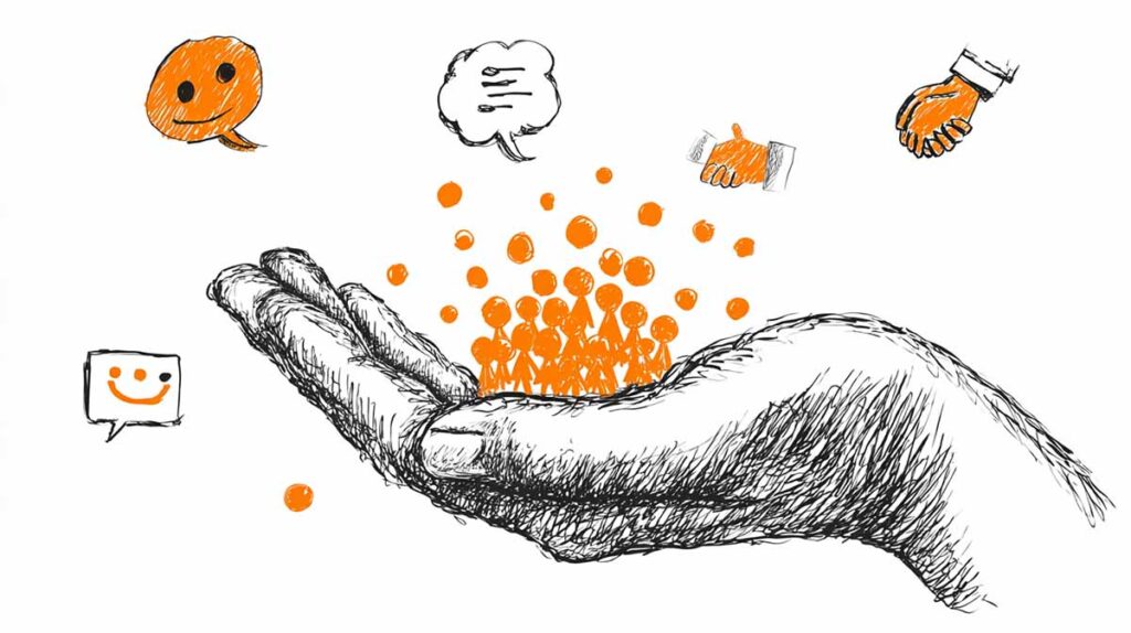 Czarno-pomarańczowy rysunek przedstawiający dużą dłoń, w której znajduje się mała postać. Symbolizuje to troskę i wartość, jaką mają autentyczni pracownicy w filmie rekrutacyjnym.